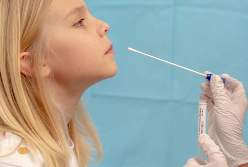 Child getting a COVID-19 test.