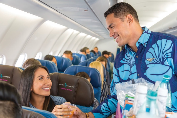 hawaiian airlines extra comfort premium seating serving drinks