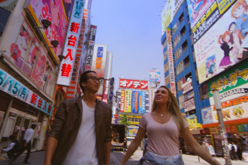 Greer and Keiichi walking down Japanese street