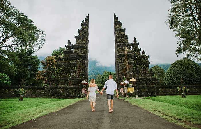Couple holding hands in Bali 