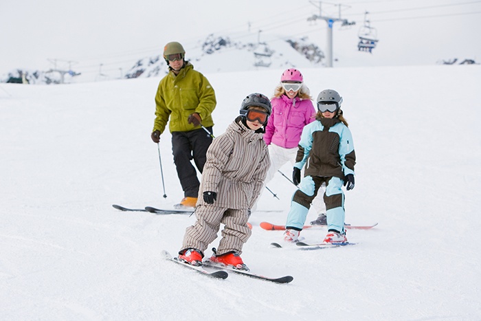 A family skis down the slopes together at Whistler Blackcomb