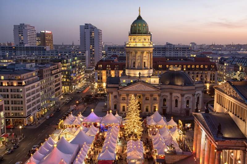 Aerial view of the Christmas Market at Gendarmenmarkt in Berlin. The sun is just setting