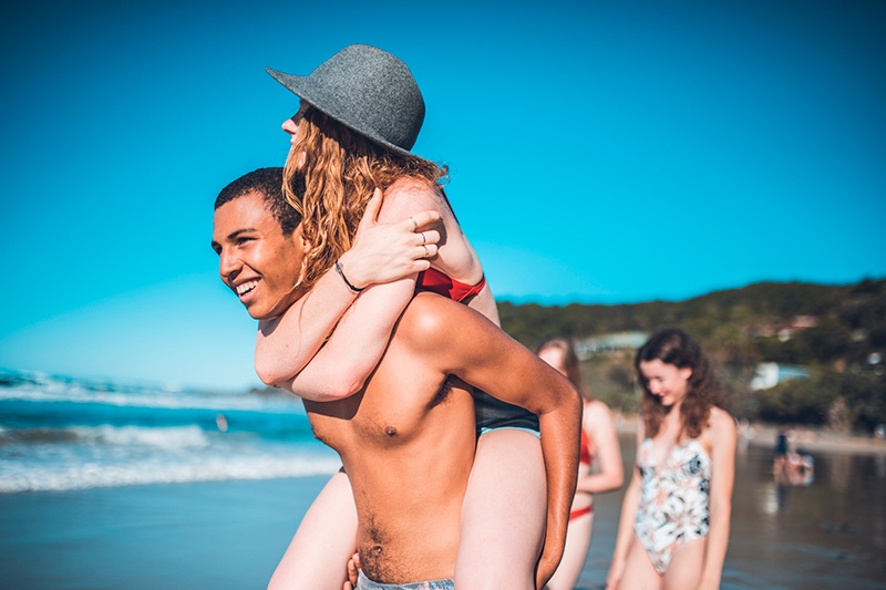 Young people on a beach in Byron Bay