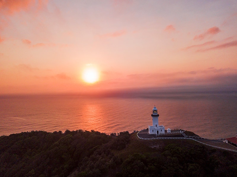 Sunset view of the lighthouse on top of the mountain