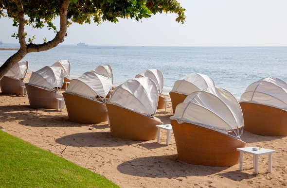 cocoon beach chairs in one of the beautiful resorts in Bali
