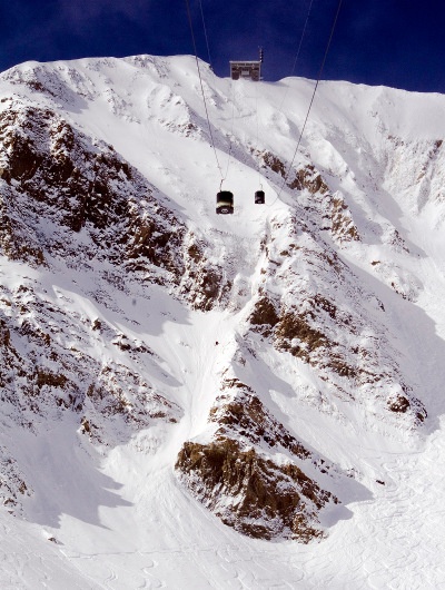  Ski lift over snowy mountains 