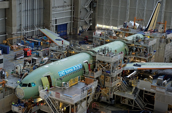  a green a330 plane being manufactured