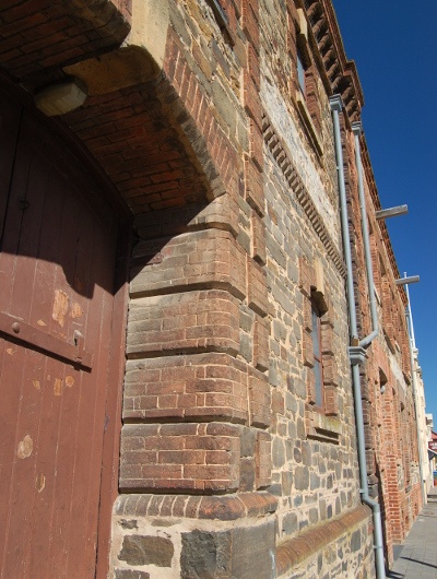  Corner shot of a multi-colored vintage brick wall