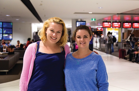  Two girls posing at the Brisbane Airport 