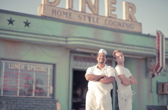  Two men posing outside the Four Aces Movie Ranch Diner set