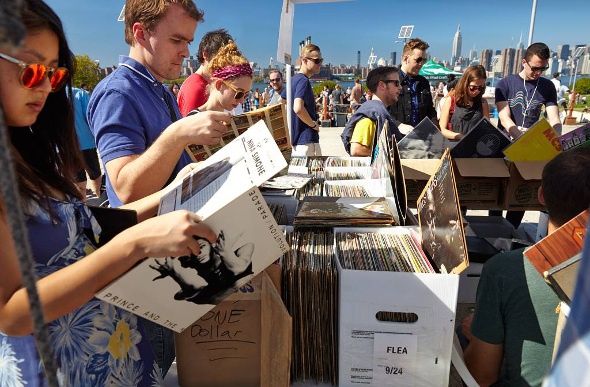 people look through boxes of records at a flea market in Bushwick New York