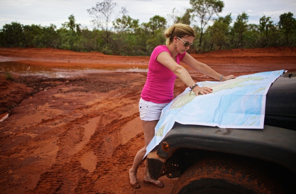  Woman reading map in outback Australia
