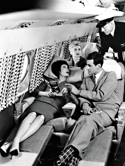 Passengers relaxing in lie-flat seats in the 1950s