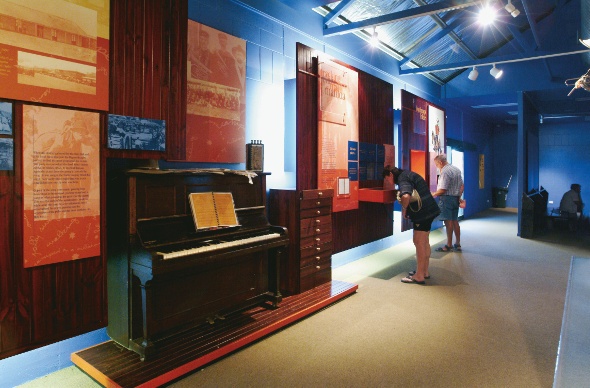 People inspecting the installations at the museum