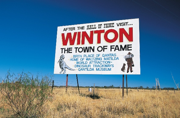 Billboard on the side of the road promoting Winton's attractions