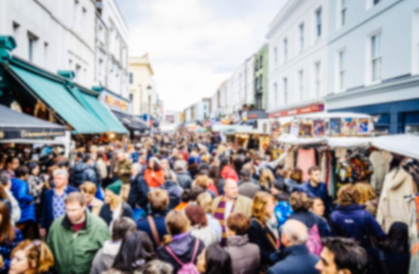 Thousands of shoppers gather at the outdoors Portobello Road Market in London on a Saturday