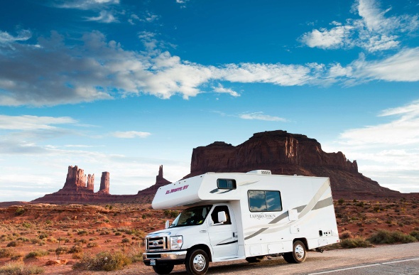 White RV traveling with great view