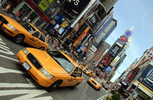 New York taxis driving past the time square