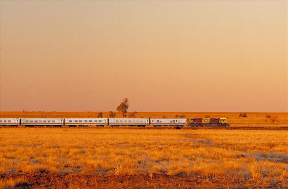 Train passing through a dry and arid landscape