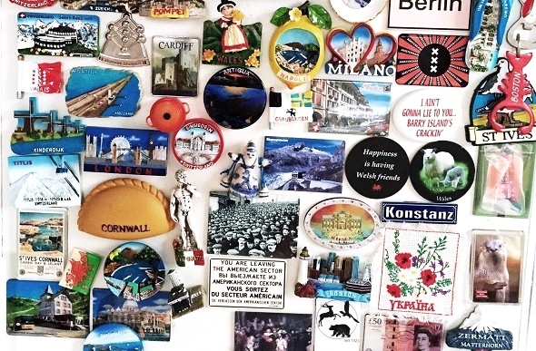  Colourful destination magnets fill the space on a fridge. 