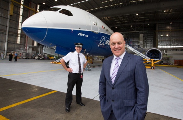Air New Zealand CEO Christopher Luxon standing in front of the company's first Boeing 787 jet
