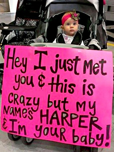  Airport sign next to babies pram 
