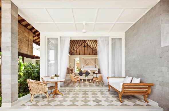 White textures and wood pieces define the minimalist veranda