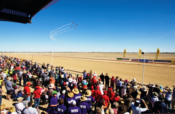 Crowd gathered at a horse racing event in  Birdsville, Australia