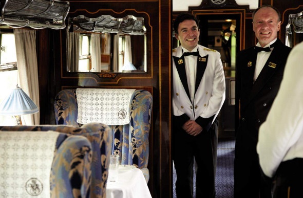 Train staff greeting patrons on the Pullman Orient Express