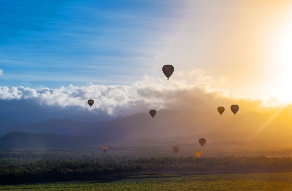 Hot air balloons rising into the sky