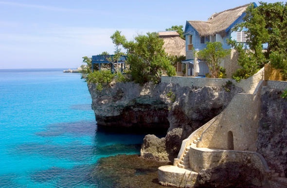 The Caves Hotel in Negril, Jamaica, perfect for romance and relaxation. Experience the cliff side resort. 