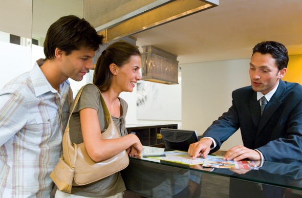 Concierge sorting out the queries of the guests