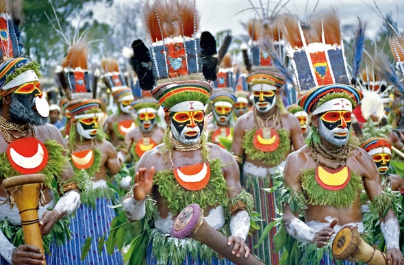 Papua New Guinea locals dressed in traditional garb