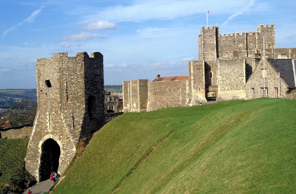  the dover castle is resting on a green hill