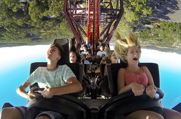  Tourists riding a roller coaster upside down shot