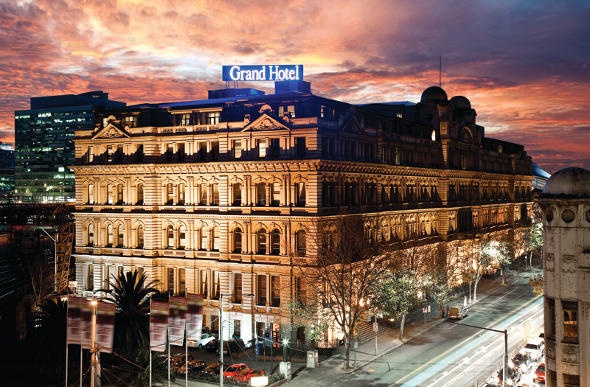 Grand Hotel Melbourne's exterior during nighttime