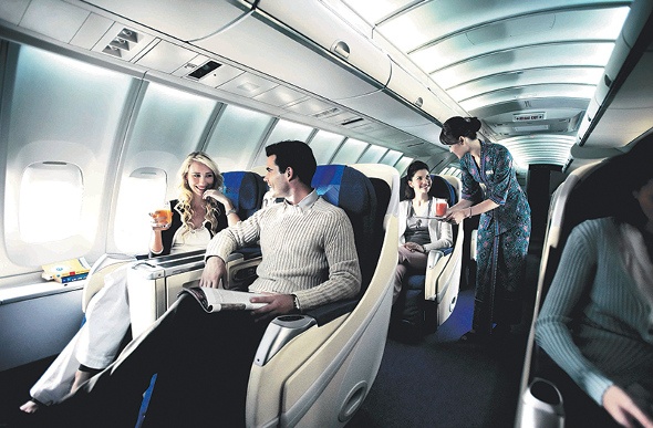  People relaxing in Malaysia Airlines business class 
