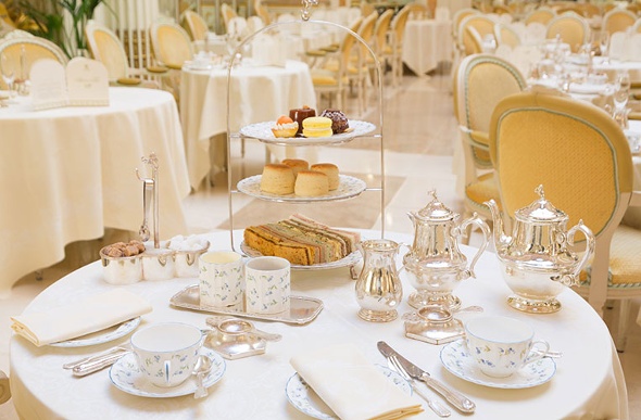 Silverware and tasty treats are poised for afternoon tea at the Ritz London.