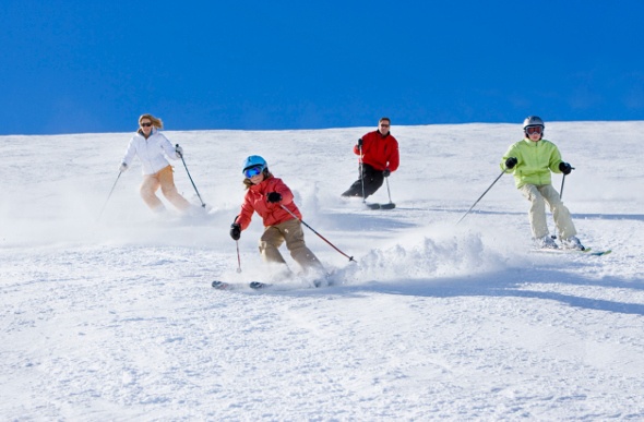  a family enjoying a nice skii together