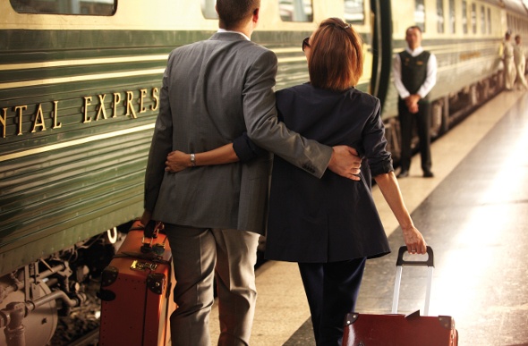  Couple walking together towards the train entrance