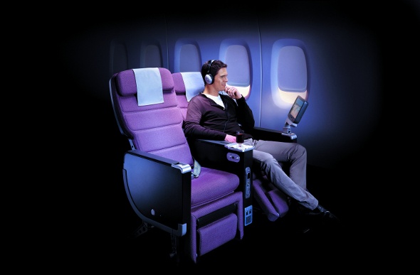 Wide seats with leg support and screen display for premium economy passengers