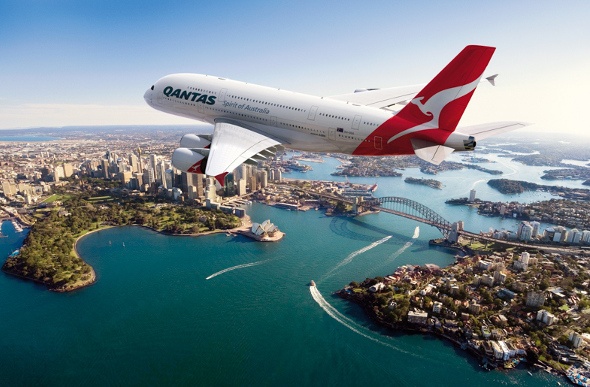  Qantas plane flying over the Sydney Harbour
