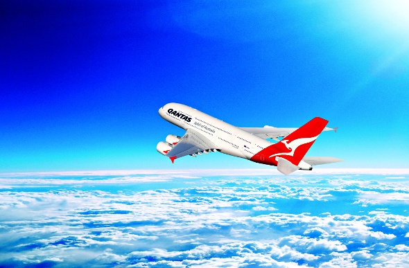 Qantas plane flying up in the clouds
