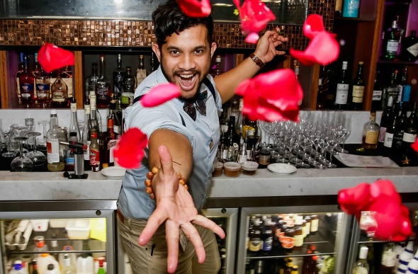 bar attender throwing rose petals