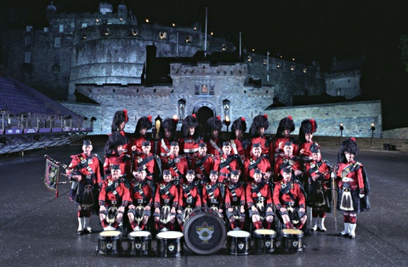 Marching band wearing matching red and black uniform