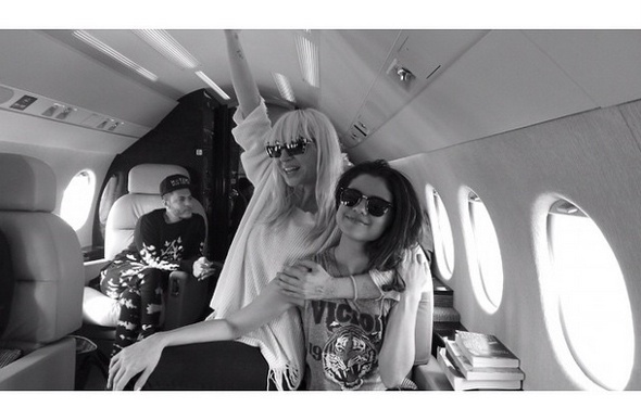  Black and white photo of Selena Gomez and friends in private jet 