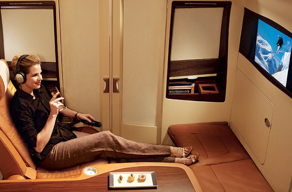  Woman watching a movie in the suite cabin 