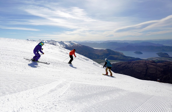 Skiers admire the view at Treble Cone, New Zealand.