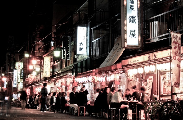 People enjoying Street side Dining in Tokyo at night time
