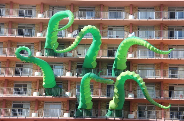  Green tentacles sticking out of a building